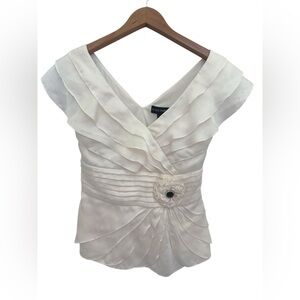 Cachet Ruffled V-Neck Satin Top with Floral Accent